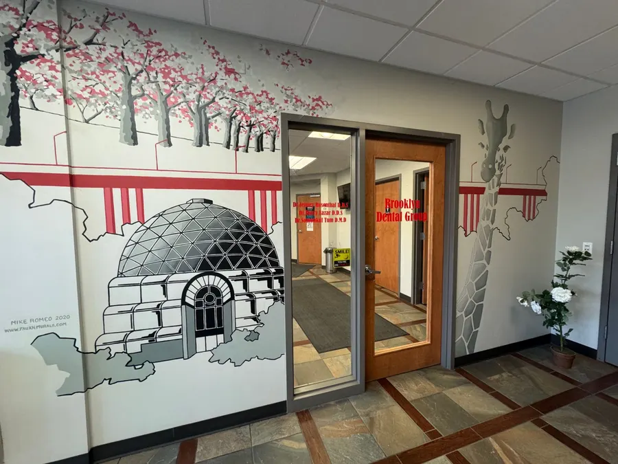 The suite entrance framed by hand-painted murals