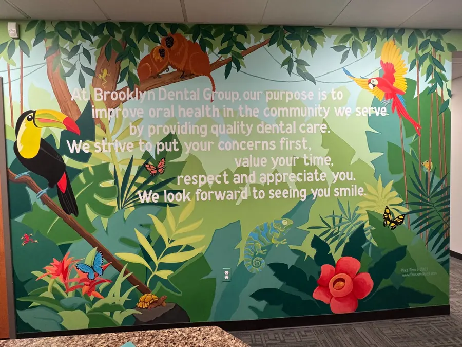 The jungle mural carrying the Brooklyn Dental Group mission statement
