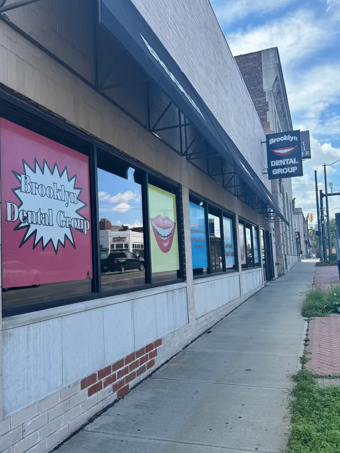 The window signs along the sidewalk